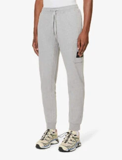 Stone Island Brand-patch Zip-pocket Cotton-jersey Jogging Bottoms -Selfidges Launches R04188791 MELANGEGREY ALT02