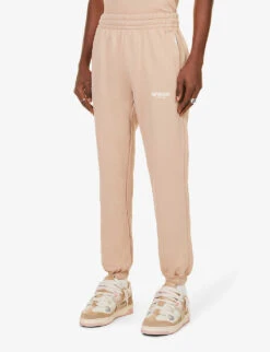 Represent Owners' Club Text-print Relaxed-fit Cotton-jersey Jogging Bottoms -Selfidges Launches R04195312 STUCCO ALT02